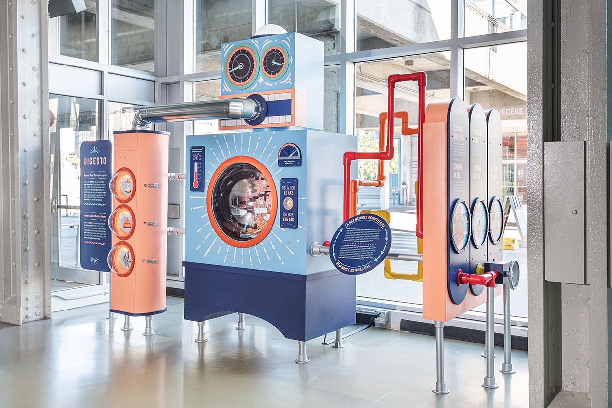 Installation muséographique interactive de Studio Overall, simulant un système de gaz naturel.